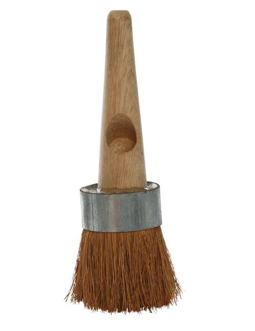 Tar brush with round head with tough, dark brown coco bristles and a very short wooden handle