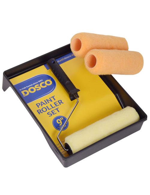 A paint roller frame and three roller sleeves appear with a black plastic paint tray in Dosco blue and yellow packaging